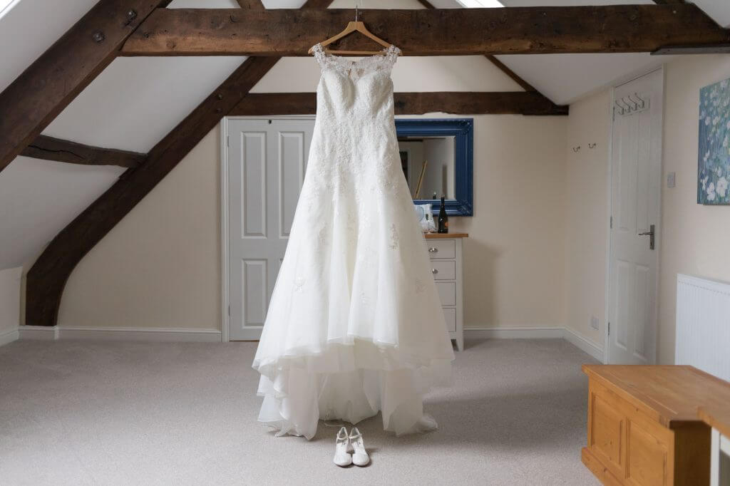 01 bride preparation long white flowing dress berkeley castle gloucestershire oxfordshire wedding photography