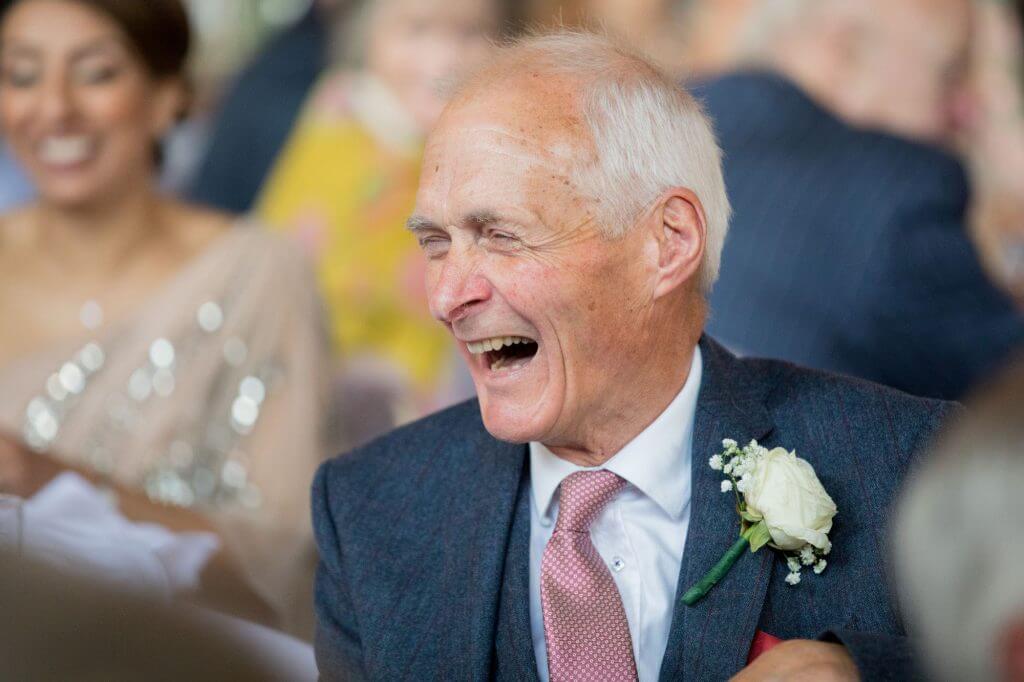 23 invited guest laughing listening to seated dinner reception speeches stoneleigh abbey stately home venue kenilworth warwickshire oxfordshire wedding photographer
