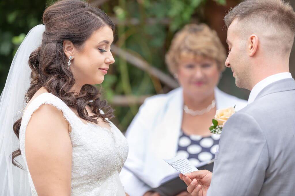 28 bride groom exchange vows summer garden marriage ceremony oxford wedding photographer