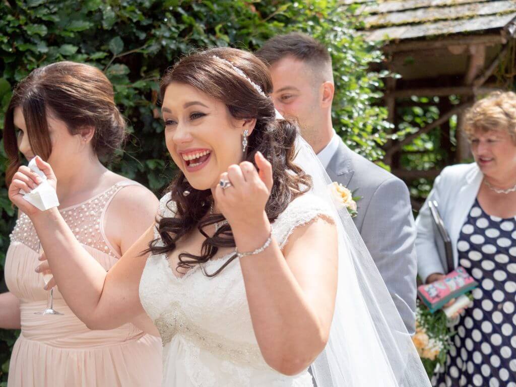 31 just married happy bride shows rings open air ceremony oxford wedding photography