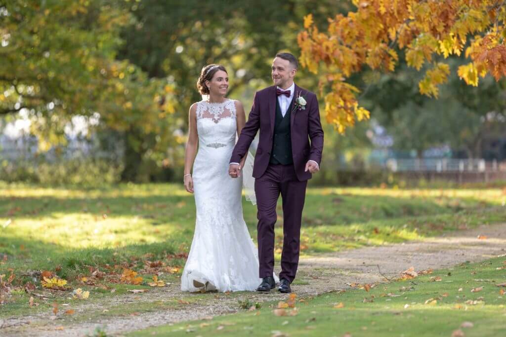 36 just married couple stroll in milton hill house grounds steventon oxfordshire wedding photography