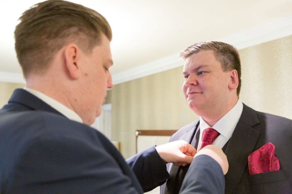 best man adjusts grooms tie south lodge hotel west sussex oxford wedding photographers