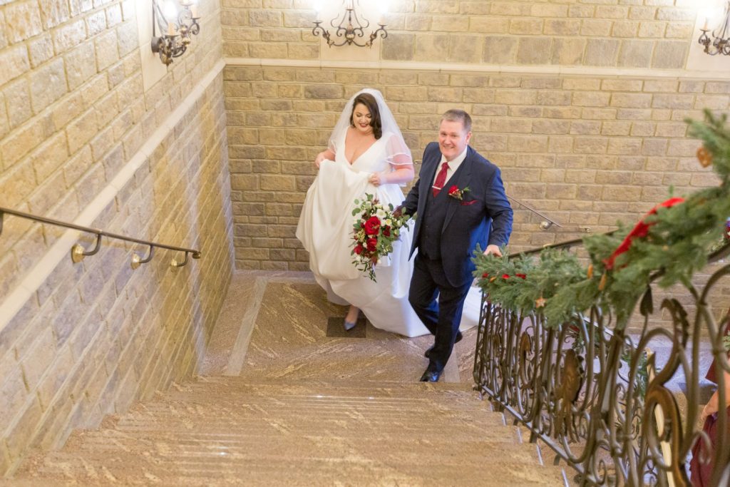 bride and father of bride on staircase south lodge hotel wes sussex oxford wedding photographer