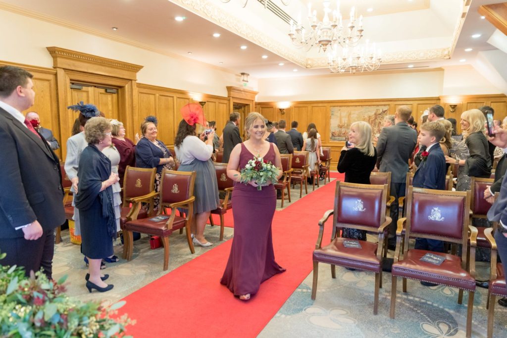 bridesmaid walks down aisle south lodge hotel west sussex oxford wedding photographer