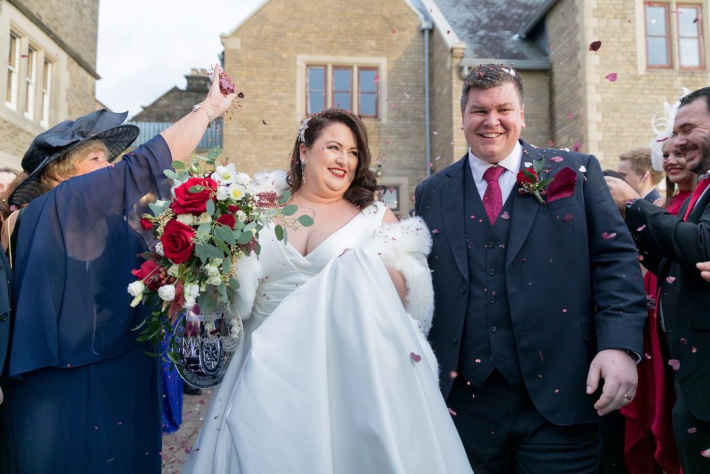 bride groom showered in confetti south lodge hotel horsham west sussex oxfordshire wedding photography