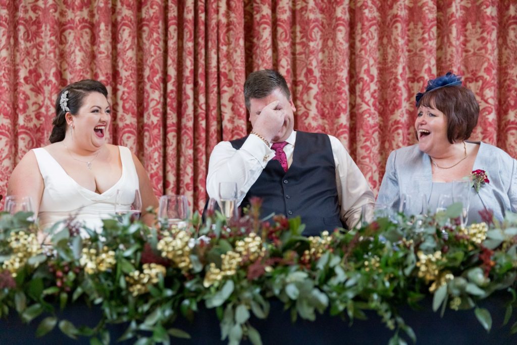 bride mother groom laugh at best man speech south lodge hotel west sussex oxford wedding photographer