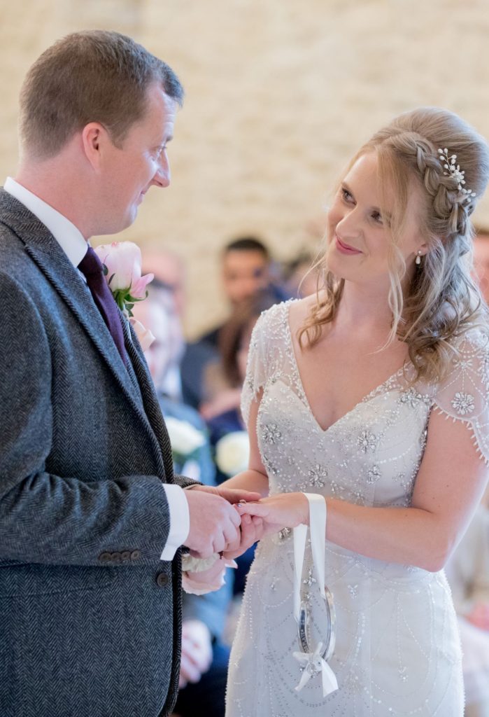 brides loving look to groom kingscote barn tetbury oxfordshire wedding photographers