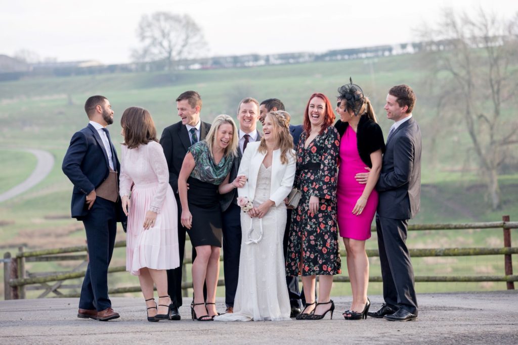 85 laughing bride groom guests traditional portrait kingscote barn oxfordshire wedding photography