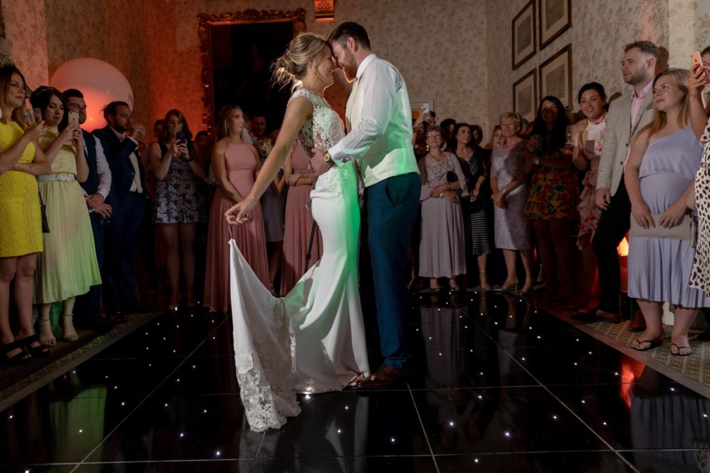 109 guests watch bride grooms first dance the elvetham hartley wintney hampshire oxford wedding photographer e1570539853524