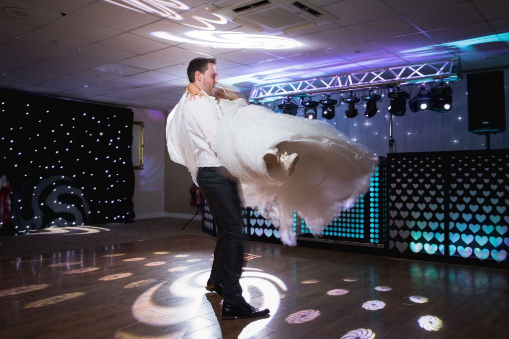 groom lifts bride first dance wroxeter hotel shrewsbury shropshire oxfordshire wedding photography