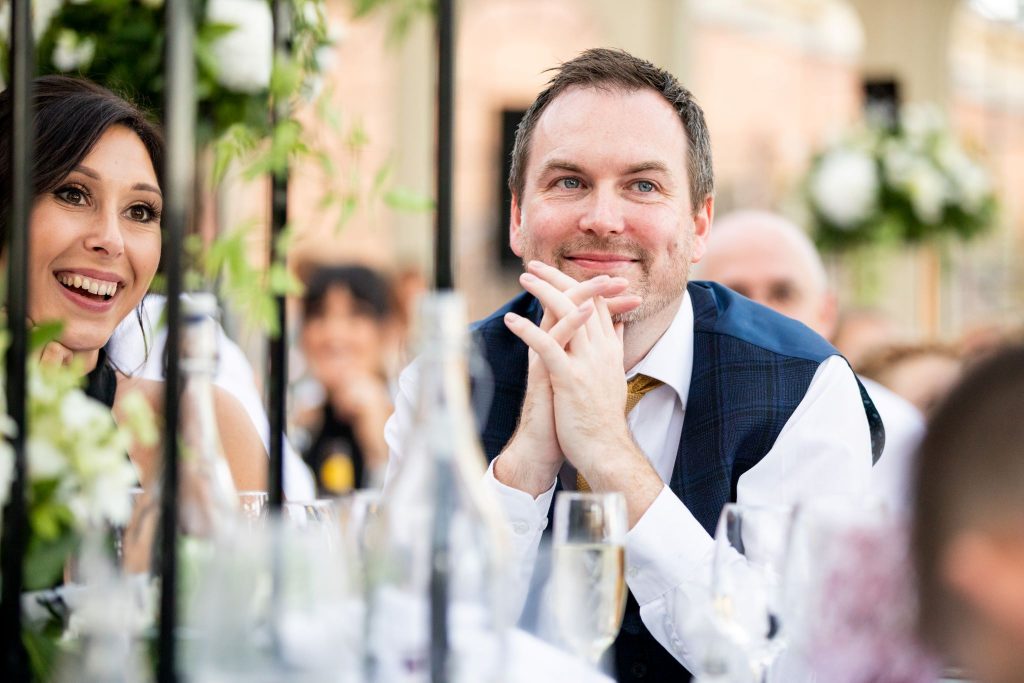 smiling guests hear orangery top table speech kilworth house hotel north kilworth leicestershire oxfordshire wedding photographers