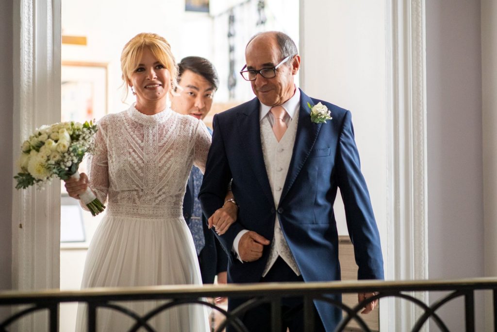 bride father of bride arm in arm lansdowne club marriage ceremony mayfair london oxford wedding photographers