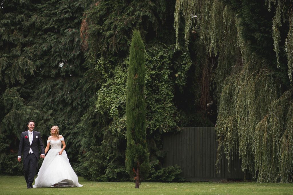 bride groom holds hands wroxeter hotel gardens shrewsbury shropshire oxford wedding photography