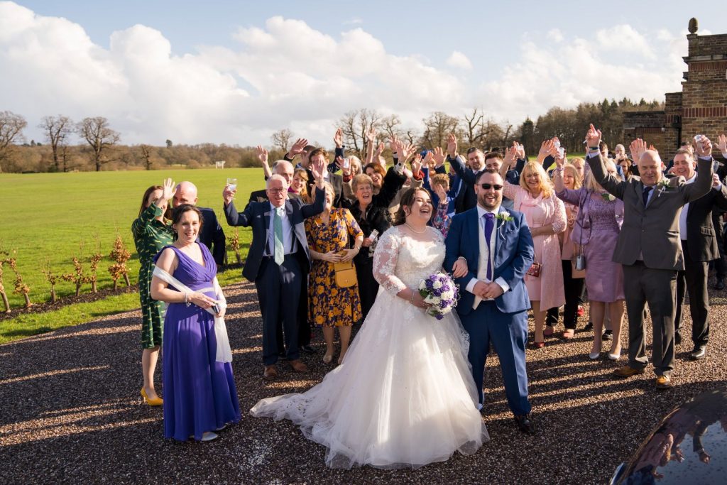 bride groom guests wave royal chapel marriage ceremony windsor berkshire oxfordshire wedding photographer