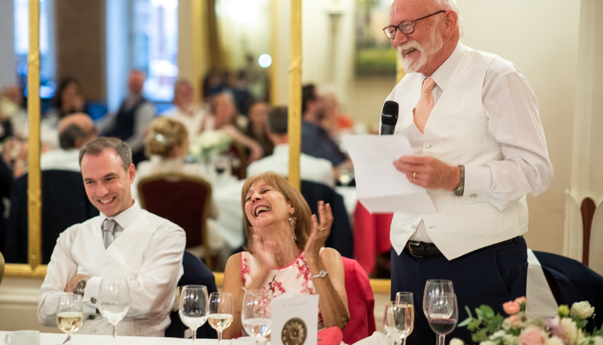 groom laughs top table speech lansdowne club mayfair london oxford wedding photography