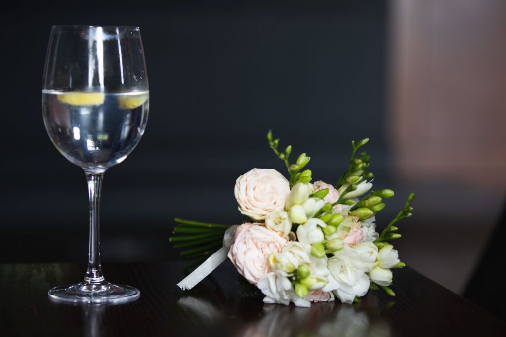 cocktail besides floral bouquet milton hill house reception steventon oxfordshire wedding photographer