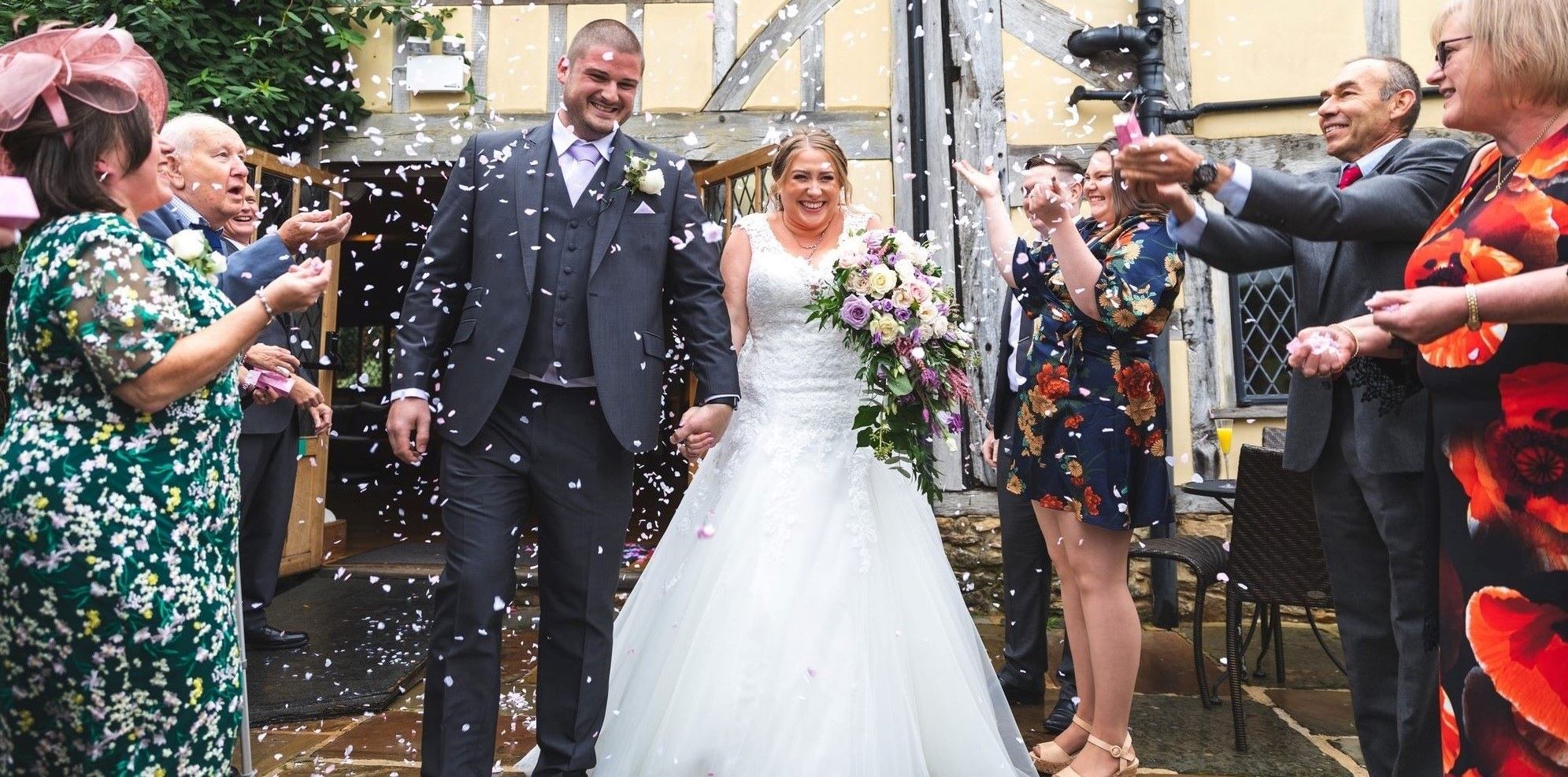 smiling bride groom enjoy confetti shower cain manor hampshire surrey borders oxfordshire wedding photographer