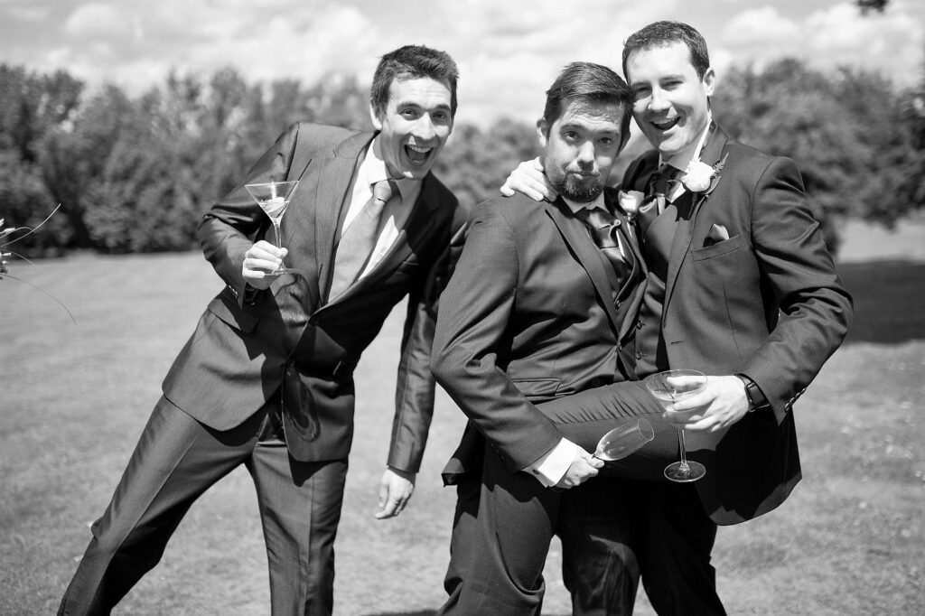 laughing guests champagne reception de vere beaumont hotel windsor oxford wedding photographer