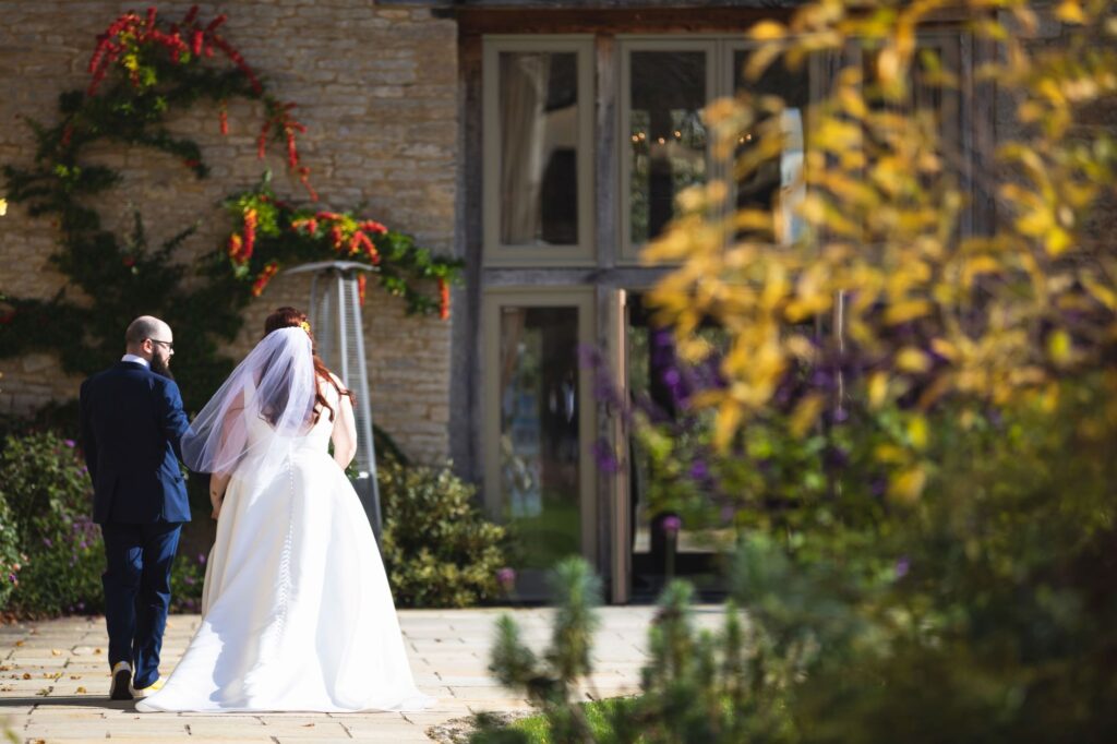 just married bride groom enter caswell house venue oxfordshire wedding photography