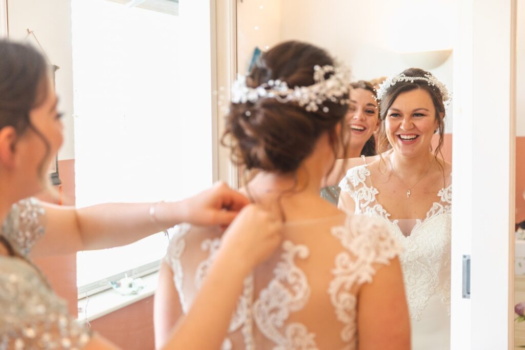 laughing bride bridesmaid sowerby bridge marriage oxford wedding photography