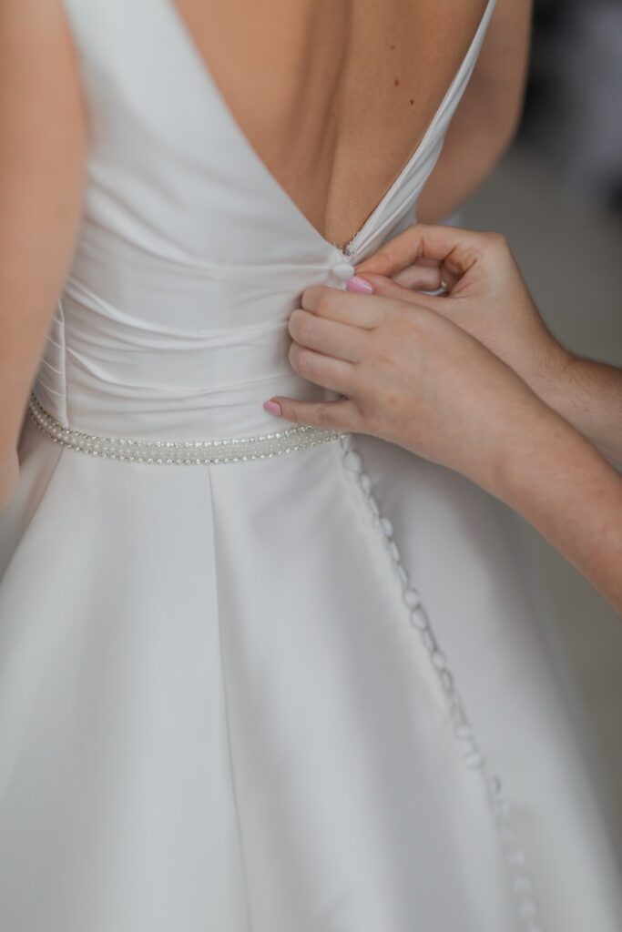 brides dress buttoned bridal preparation holdenby northamptonshire oxfordshire wedding photographers