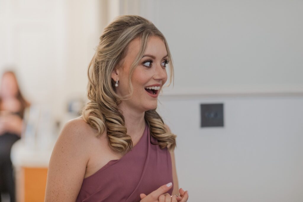 bridesmaid gasps brides dress first look holdenby northamptonshire oxford wedding photographer