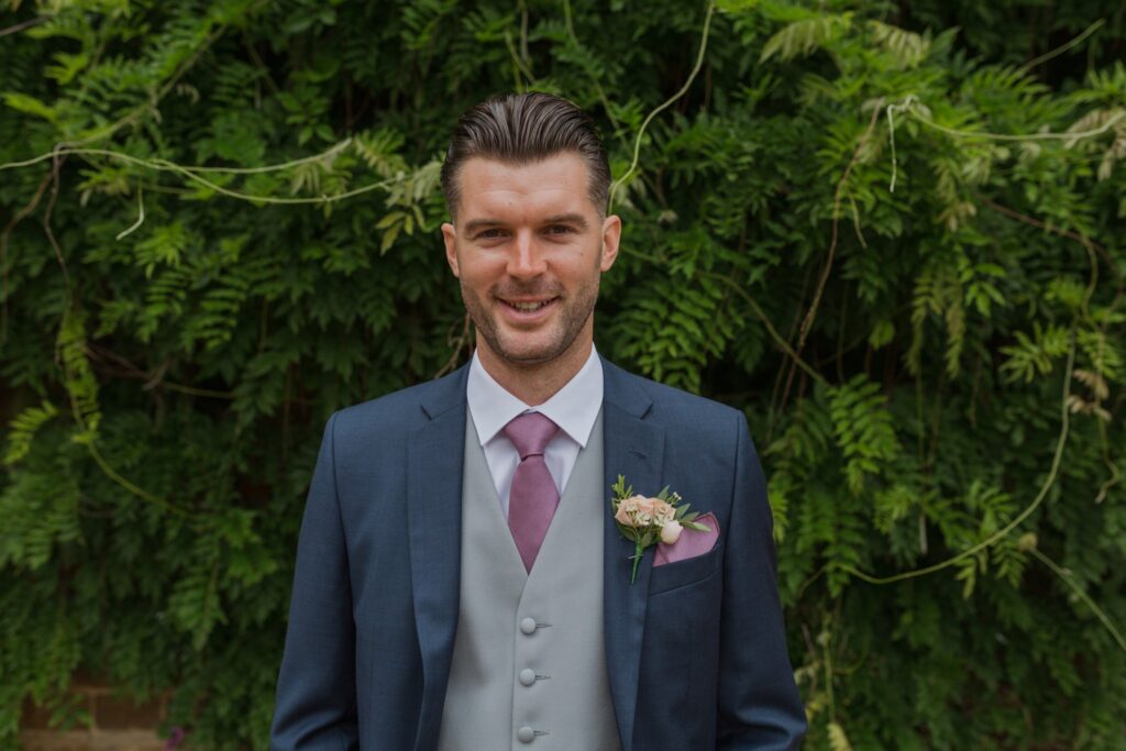 smiling grooms portrait holdenby northamptonshire oxford wedding photographer