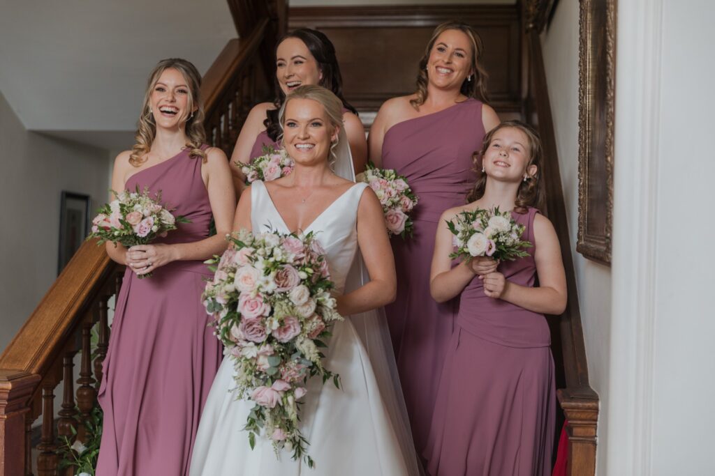 bride bridesmaids hold bouquets holdenby northamptonshire oxfordshire wedding photographers