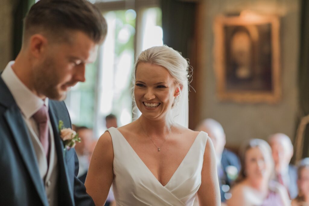 smiling bride marriage ceremony holdenby northamptonshire oxford wedding photographers