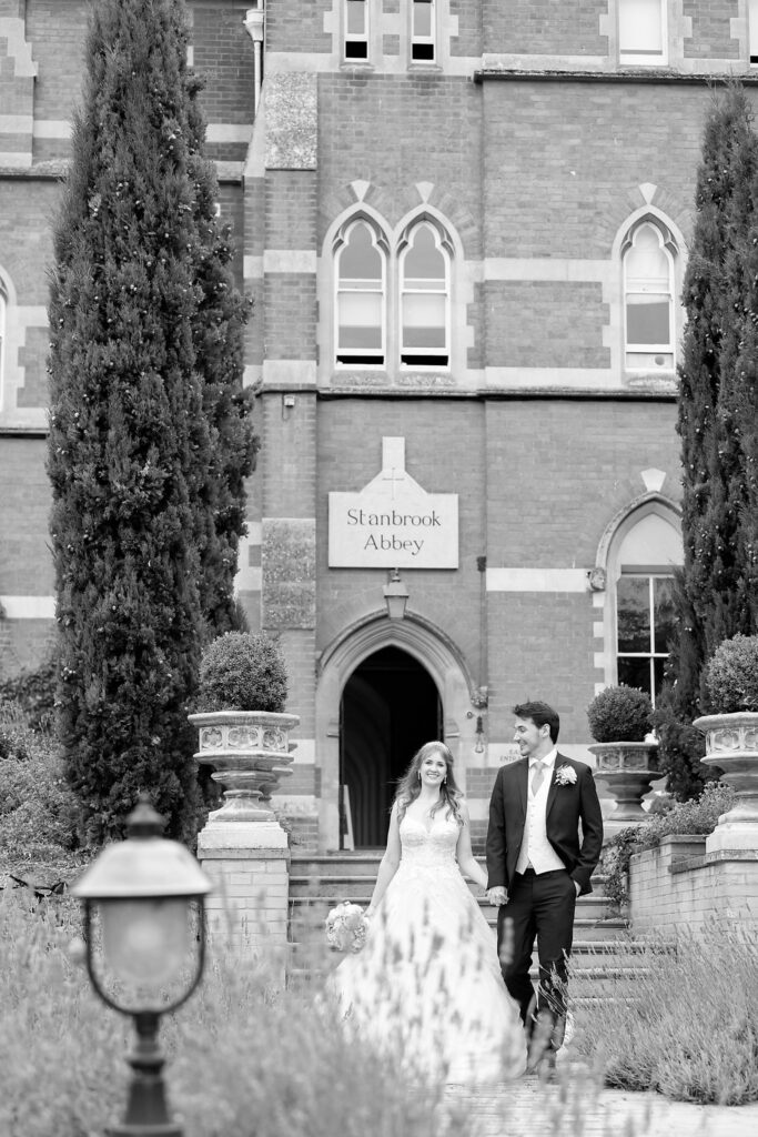 105 bride groom walk holding hands callow end lavender garden worcester oxfordshire wedding photographers