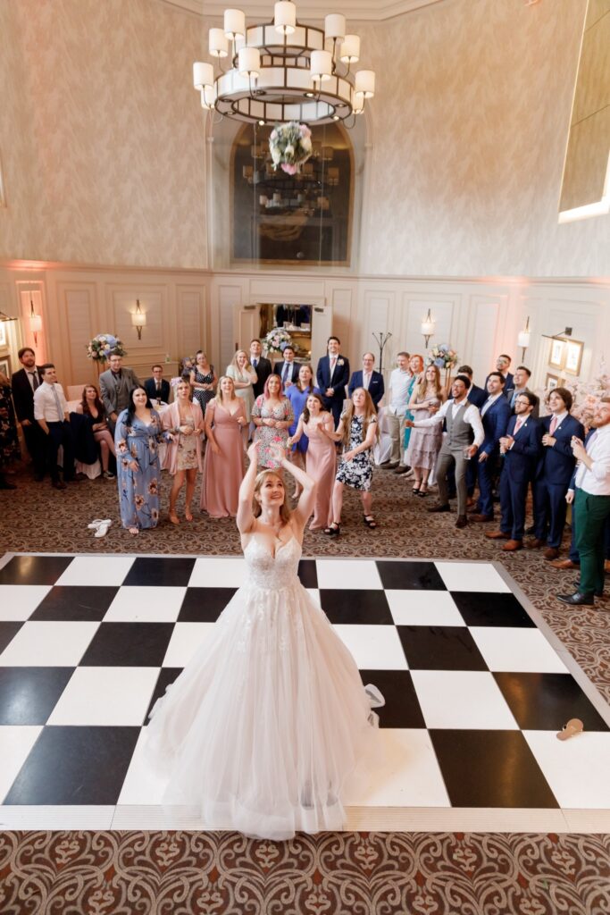 114 bride tosses bouquet callow end worcester oxford wedding photographer