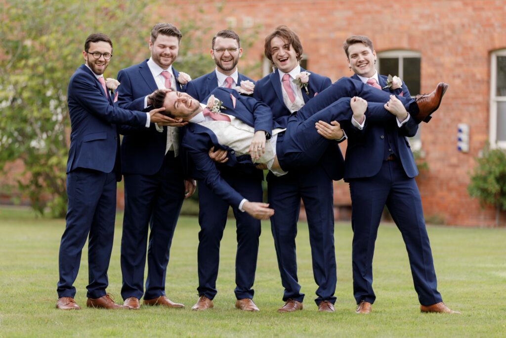 27 happy groomsmen lift groom callow end worcester oxford wedding photographers