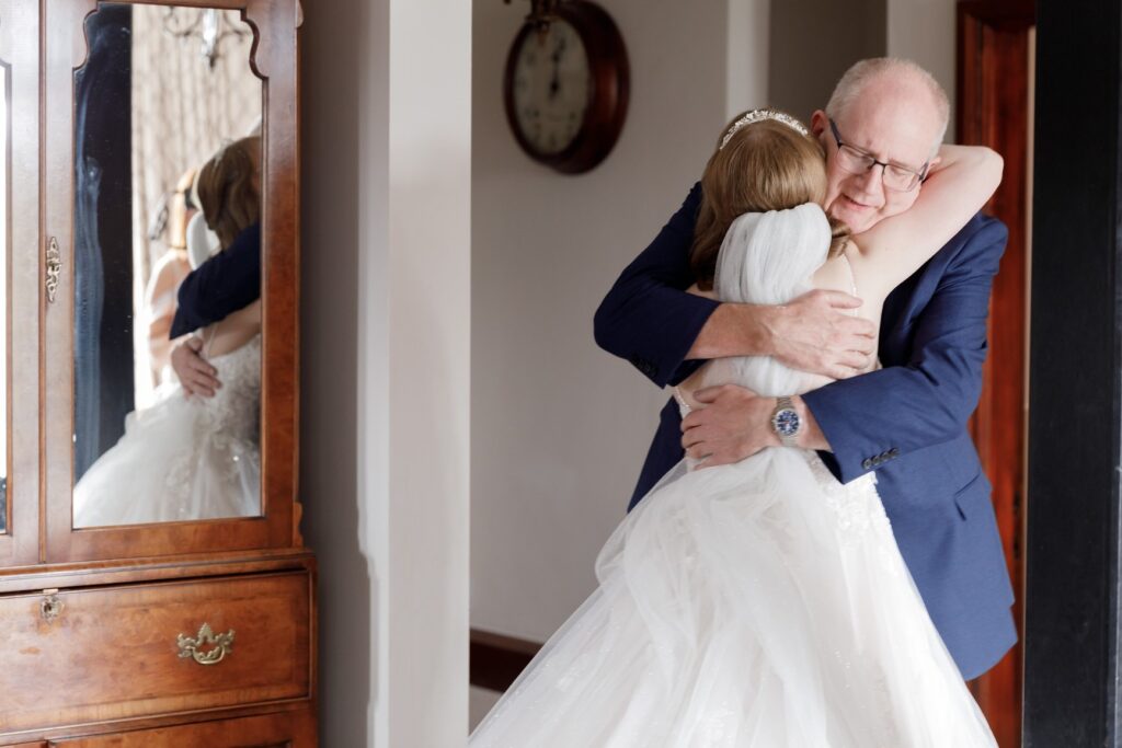 33 first look father of bride hugs daughter bridal prep callow end worcester oxfordshire wedding photographers