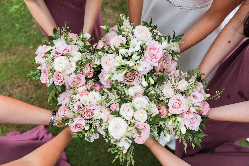 brides bridesmaids hold bouquets holdenby house northampton oxford wedding photographers