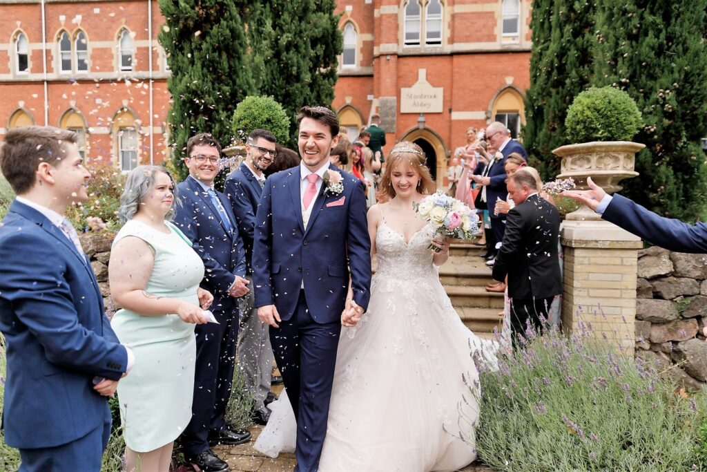 67 laughing bride grooms confettie parade callow end worcester oxford wedding photographers
