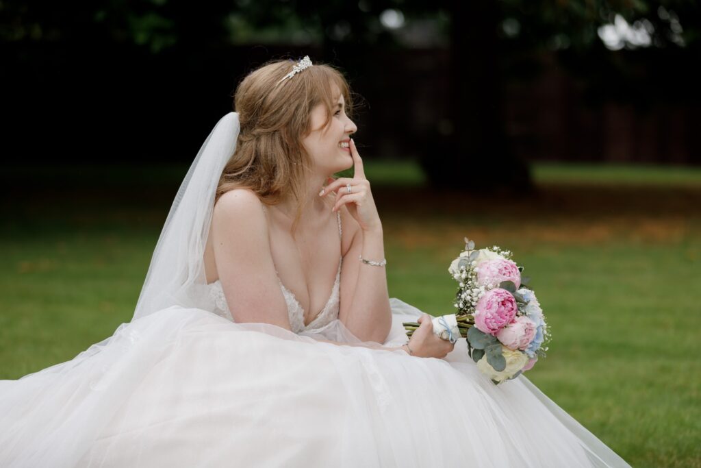 75 smiling bride holds finger to lips callow end worcester oxfordshire wedding photographer