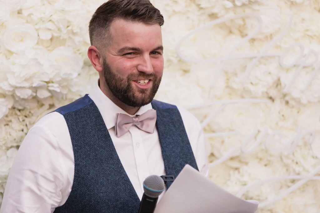 113 smiling best man delivers speech de vere hotel wotton under edge oxfordshire wedding photographers