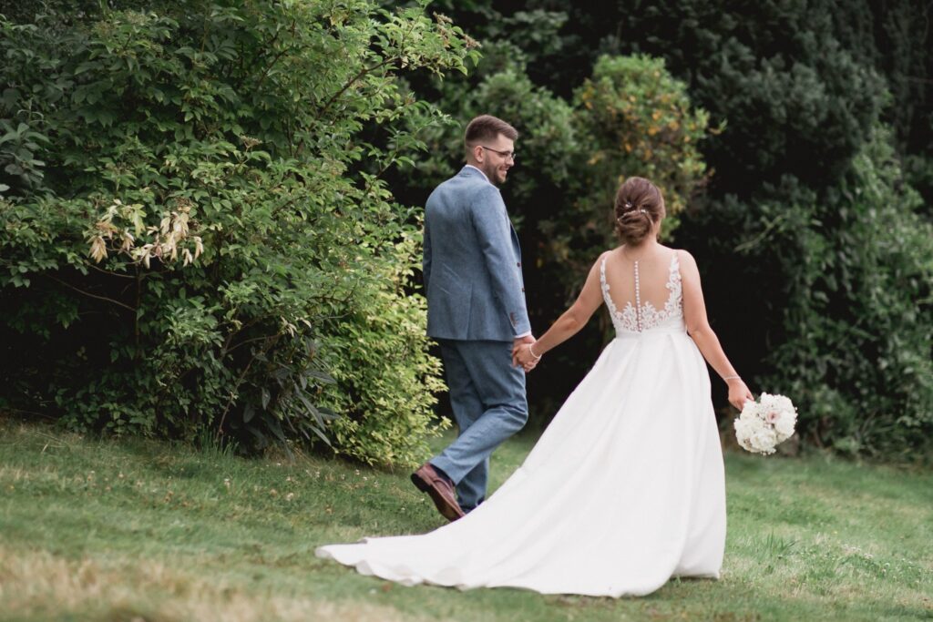 123 bride groom walk holding hands de vere hotel grounds wotton under edge oxfordshire wedding photographers