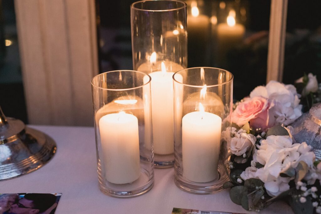 129 candles floral arrangement de vere hotel wotton under edge oxfordshire wedding photographers