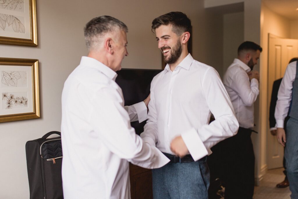 25 smiling groomsmen dress groom preparation tortworth court gloucestershire oxford wedding photographer