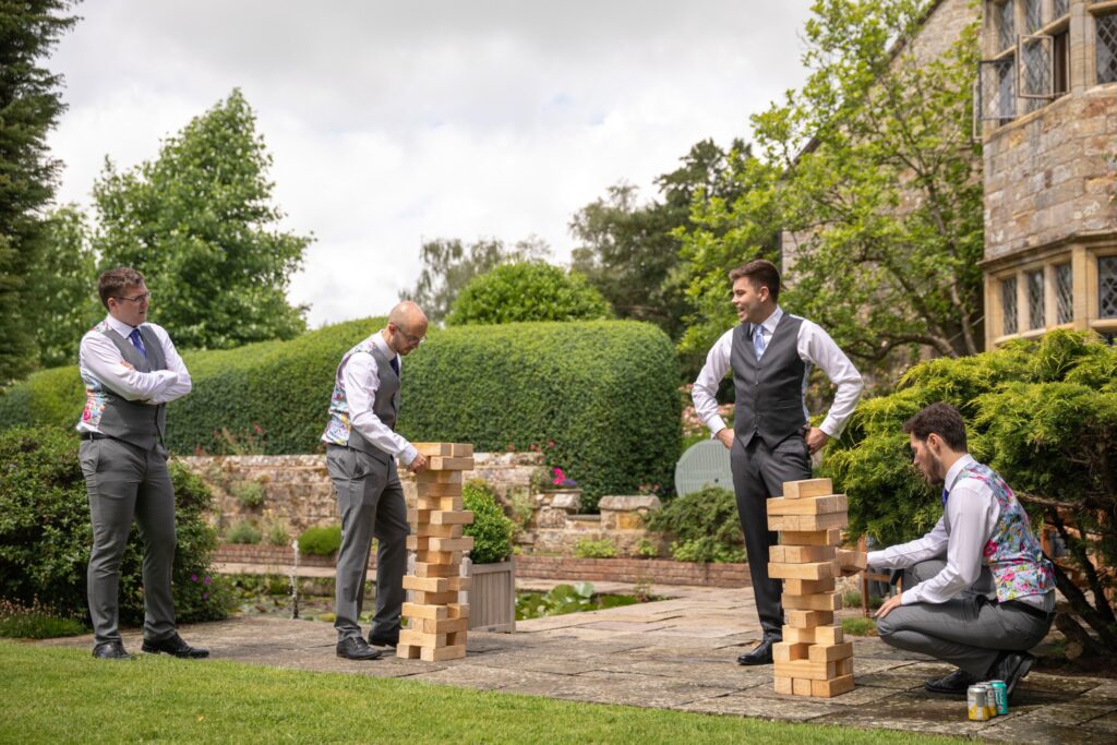 34 groom groomsmen enjoy garden games smallfield place venue surrey oxford wedding photographers