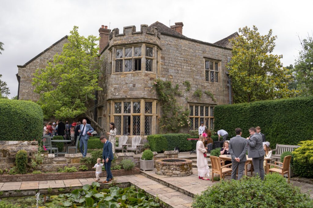 37 guests await marriage ceremony smallfield place gardens surrey oxfordshire wedding photographers