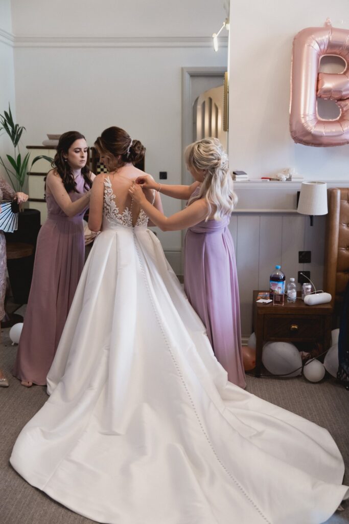 43 bridesmaids help dress bride bridal prep de vere hotel wotton under edge oxfordshire wedding photography