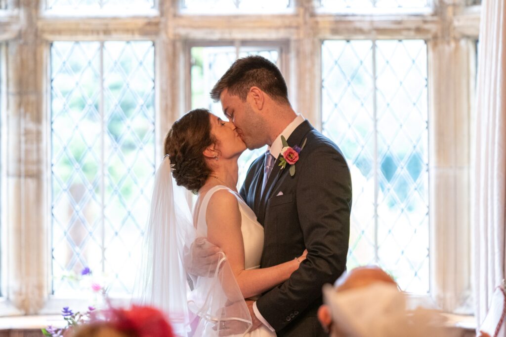 48 bride grooms first kiss marriage ceremony cogmans lane surrey oxford wedding photographer