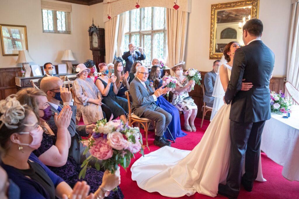 49 guests applaud bride groom marriage ceremony cogmans lane surrey oxford wedding photographers