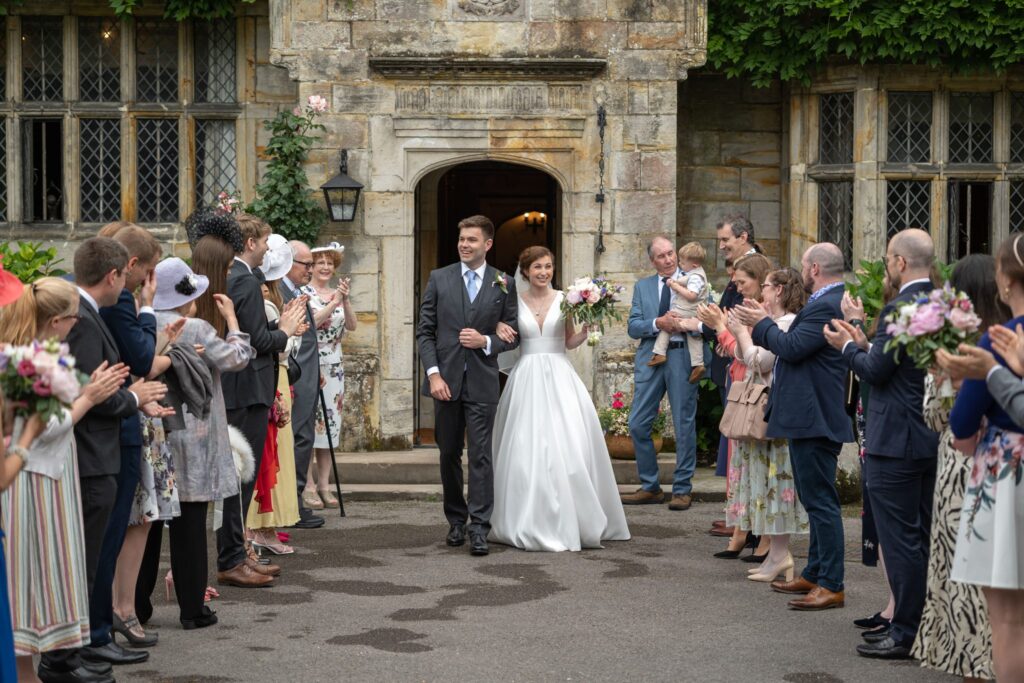 55 smiling bride groom enjoy guests applause cogmans lane surrey oxfordshire wedding photography