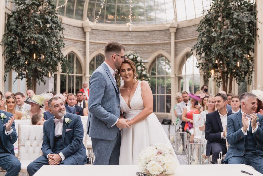63 groom kisses brides forehead marriage ceremony de vere hotel wotton under edge oxford wedding photographers