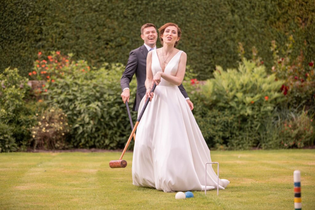 69 bride groom play croquet cogmans lane surrey oxford wedding photographers