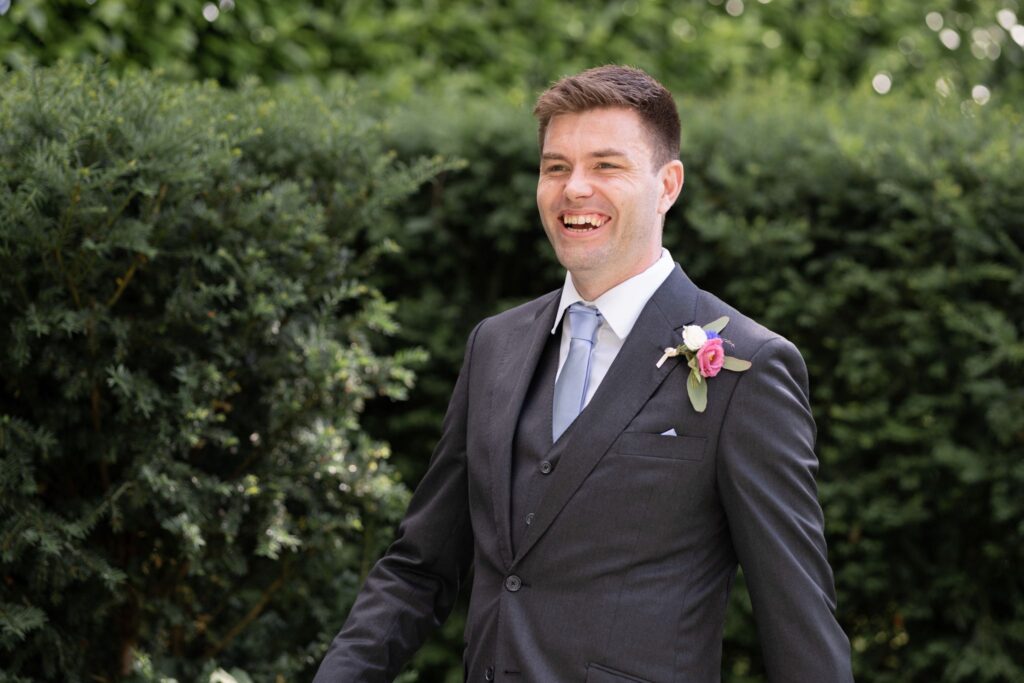 71 smiling grooms garden portrait cogmans lane surrey oxfordshire wedding photographer