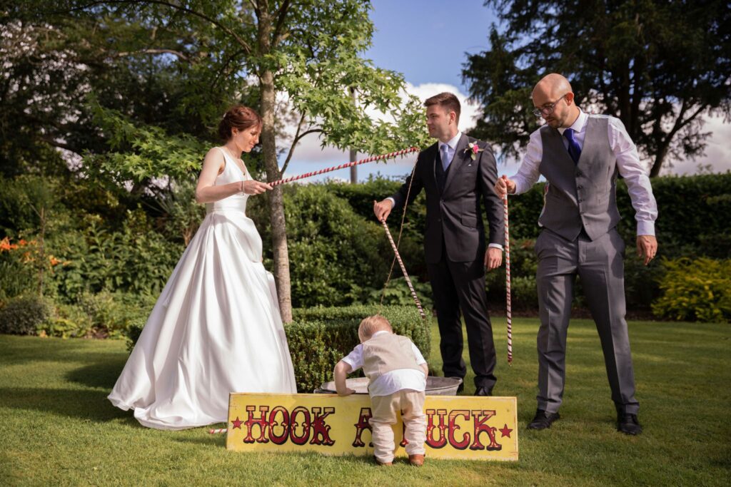 74 bride groom bestman toddler play garden game cogmans lane surrey oxford wedding photographer
